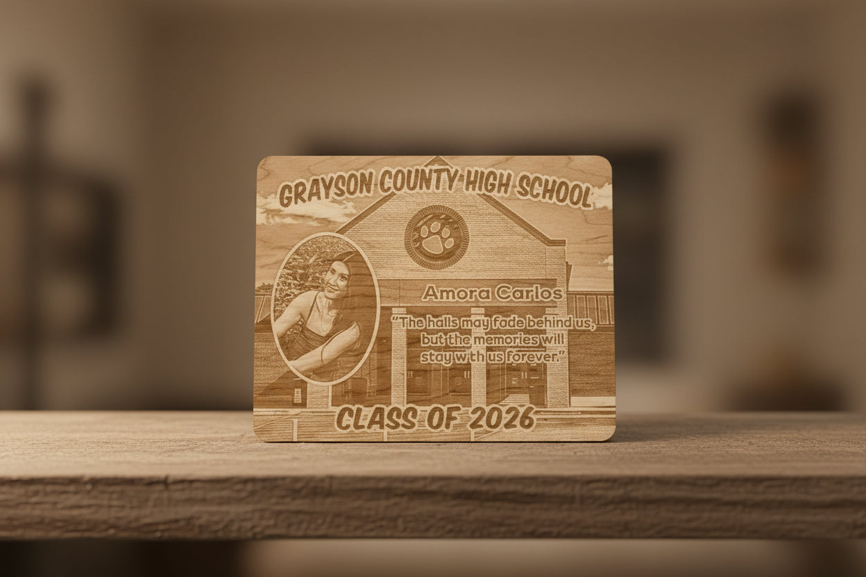 Wooden plaque with engraved text and design on a metal surface
